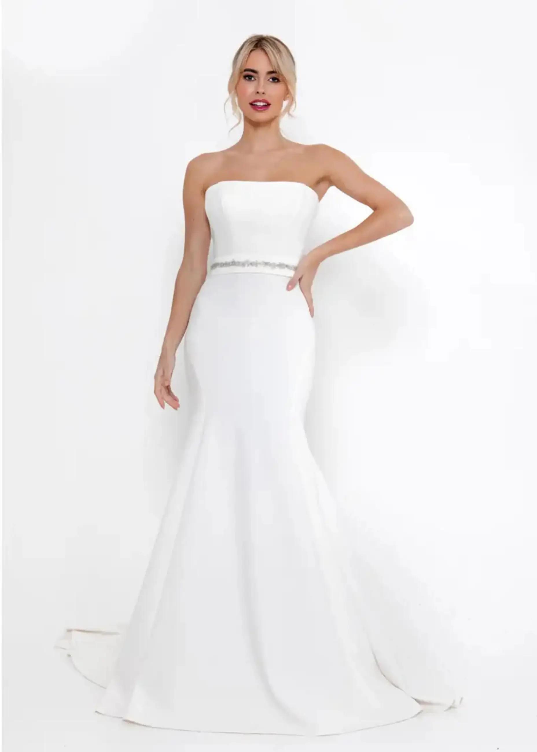 Model wearing a white gown by Randy fenoli